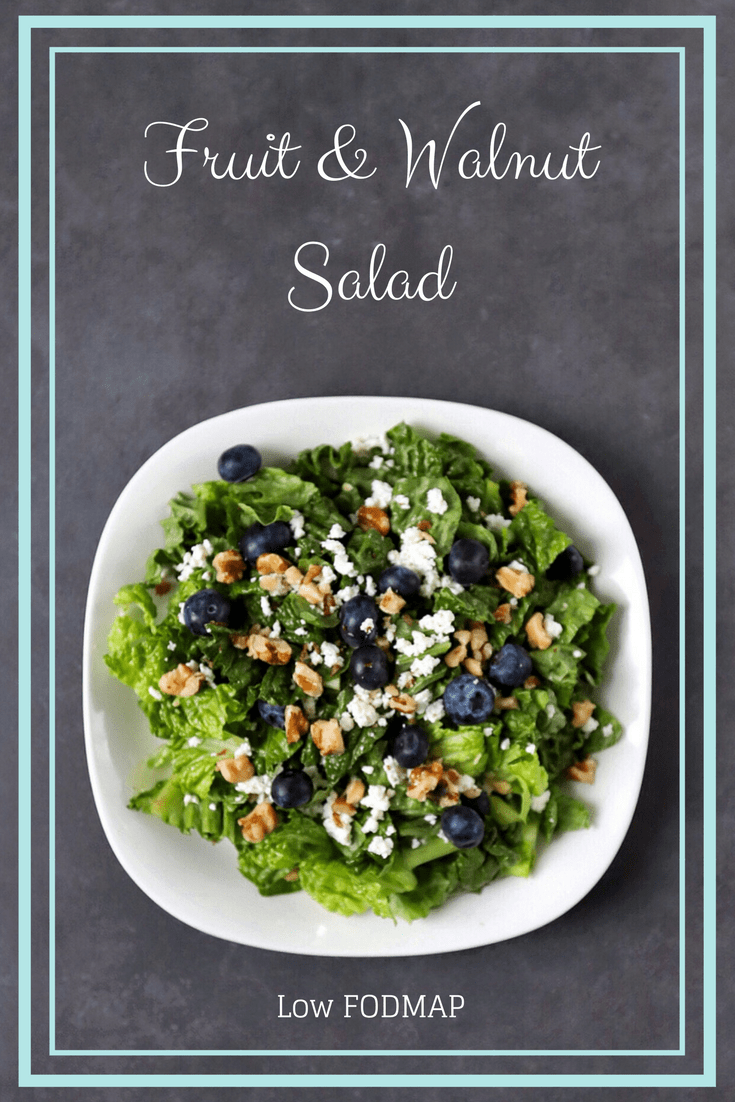 Low FODMAP Fruit and Walnut Salad on plate with text overlay: Fruit and Walnut Salad, Low FODMAP