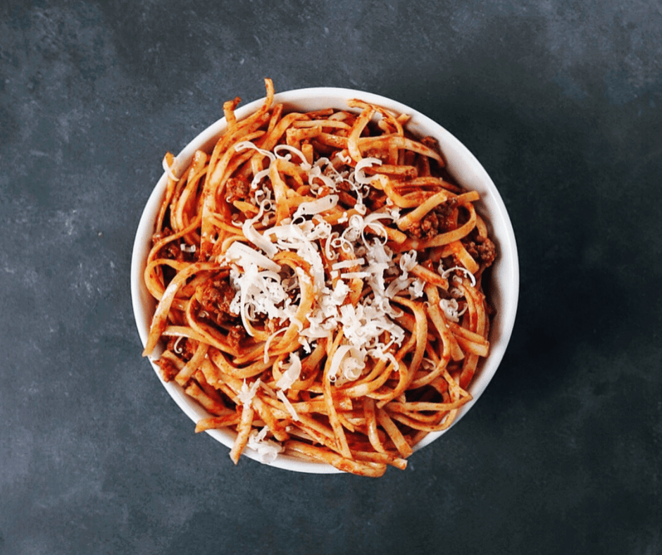 Low FODMAP spicy pasta sauce on spaghetti in bowl