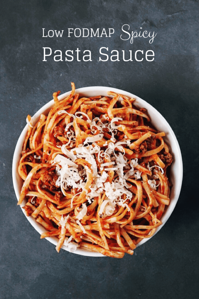 Low FODMAP spicy pasta sauce on spaghetti in bowl with text overlay: Low FODMAP Spicy Pasta Sauce