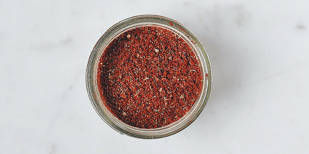 Low FODMAP Taco Seasoning in glass jar