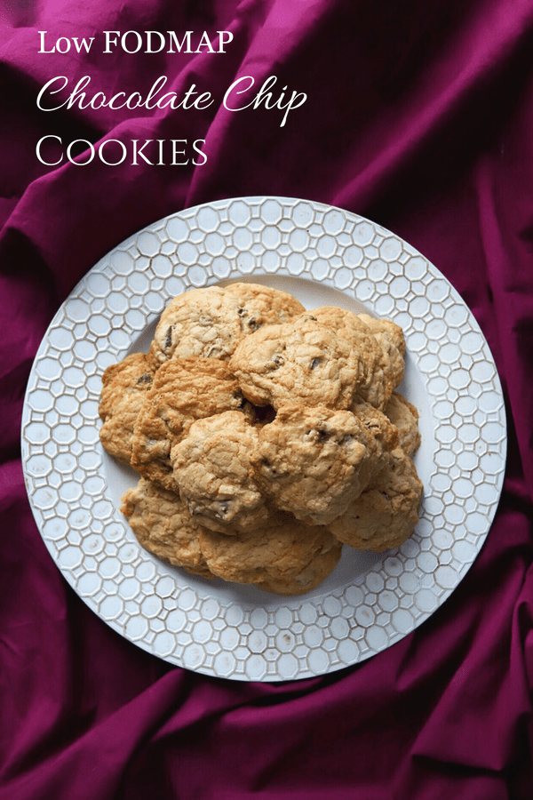 Low FODMAP Chocolate Chip Cookies sitting on decorative plate with text overlay: Low FODMAP Chocolate Chip Cookies