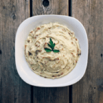 Low FODMAP Roasted Garlic Mashed Potatoes in serving dish