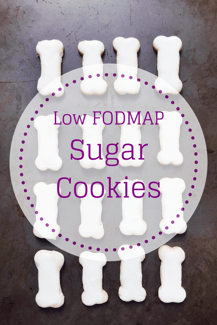 low FODMAP sugar cookies with royal icing shaped like bones and text overlay: Low FODMAP Sugar Cookies