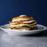 Low FODMAP pancakes stacked on a plate