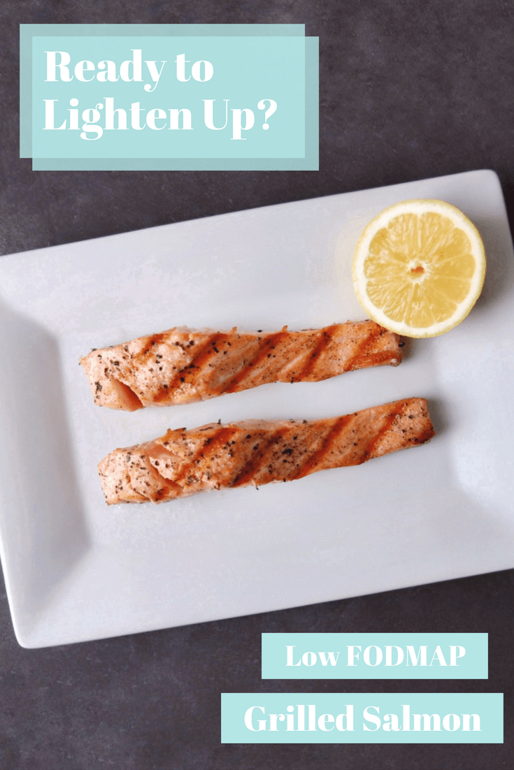 Two salmon filets on plate with lemon wedge with text overlay - ready to get light? Low FODMAP grilled salmon