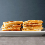 Low FODMAP sourdough waffles stacked on plate