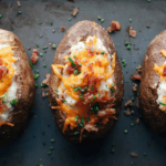 three low FODMAP twice baked potatoes on baking sheet