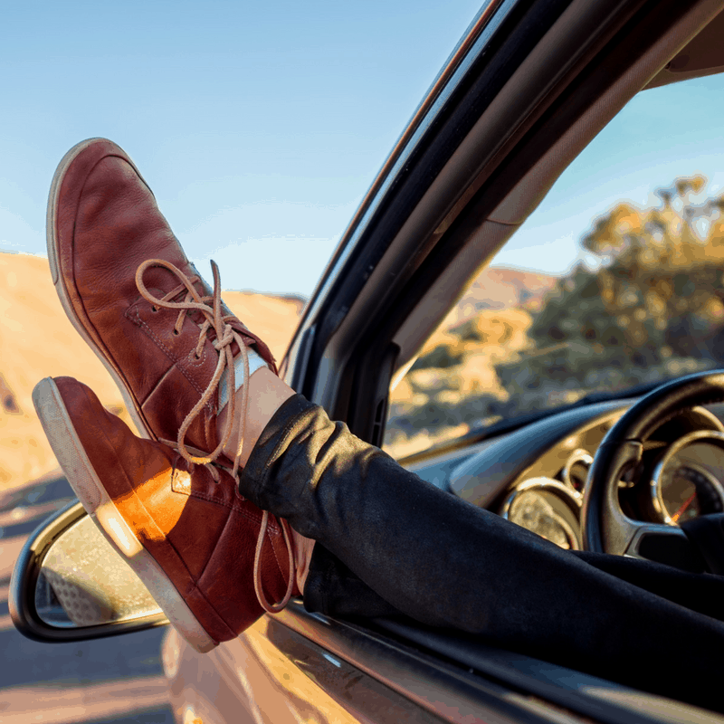 Woman's legs sticking out of car