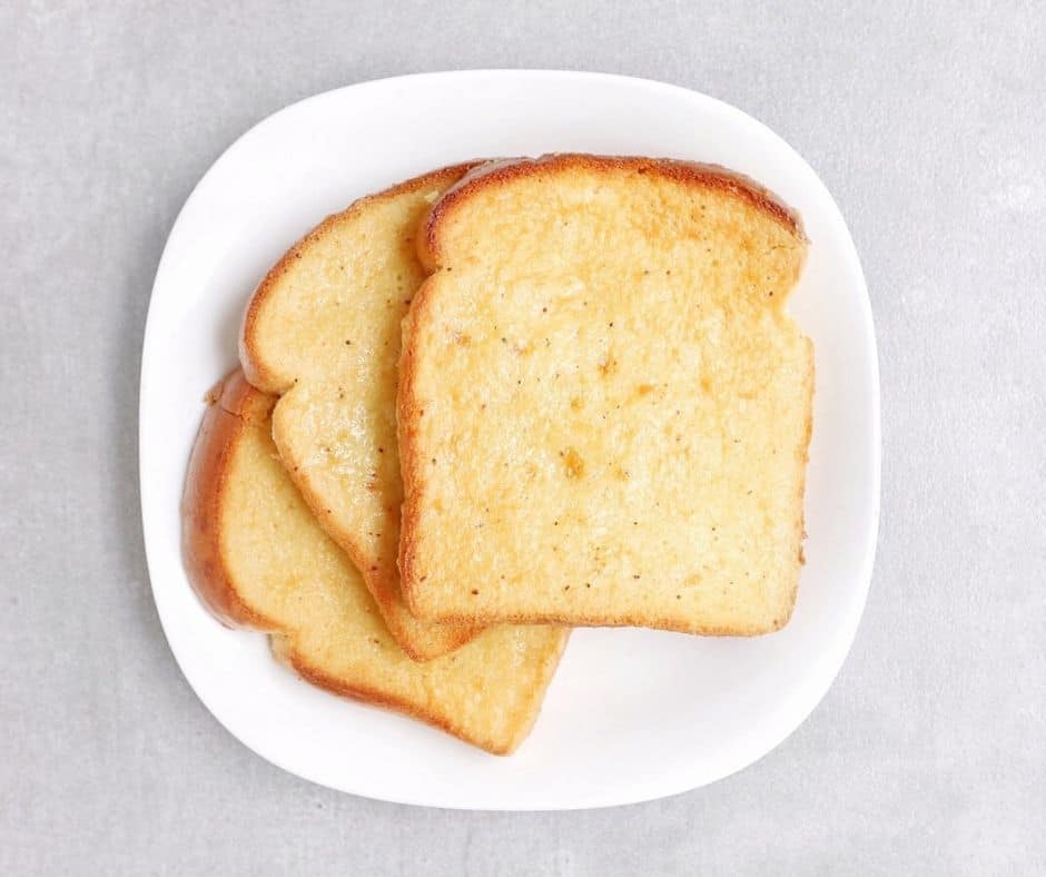 Low FODMAP eggnog french toast on white plate