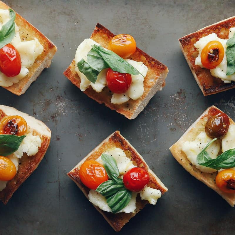 Low FODMAP Blistered Caprese Bites on Tray