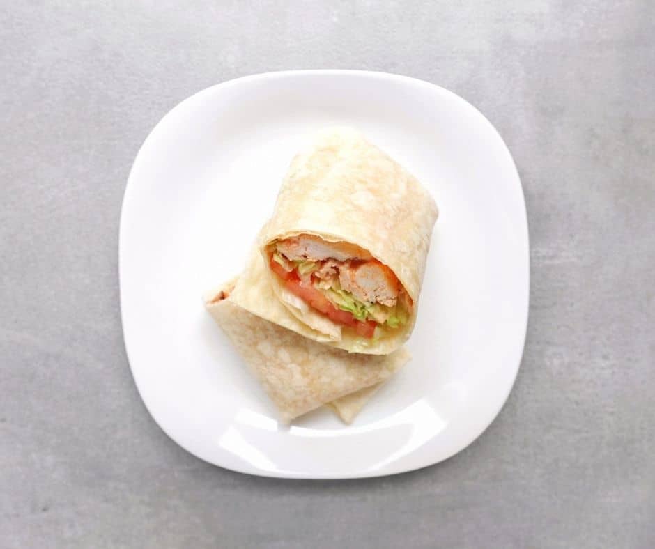 Low FODMAP Buffalo Chicken Wrap on white plate