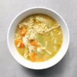 Low FODMAP chicken noodle soup in bowl - Feature Image