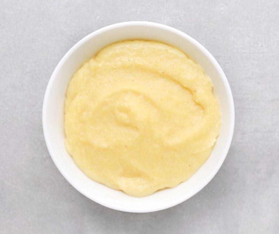 Low FODMAP creamy polenta in white bowl