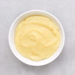 Low FODMAP creamy polenta in white bowl