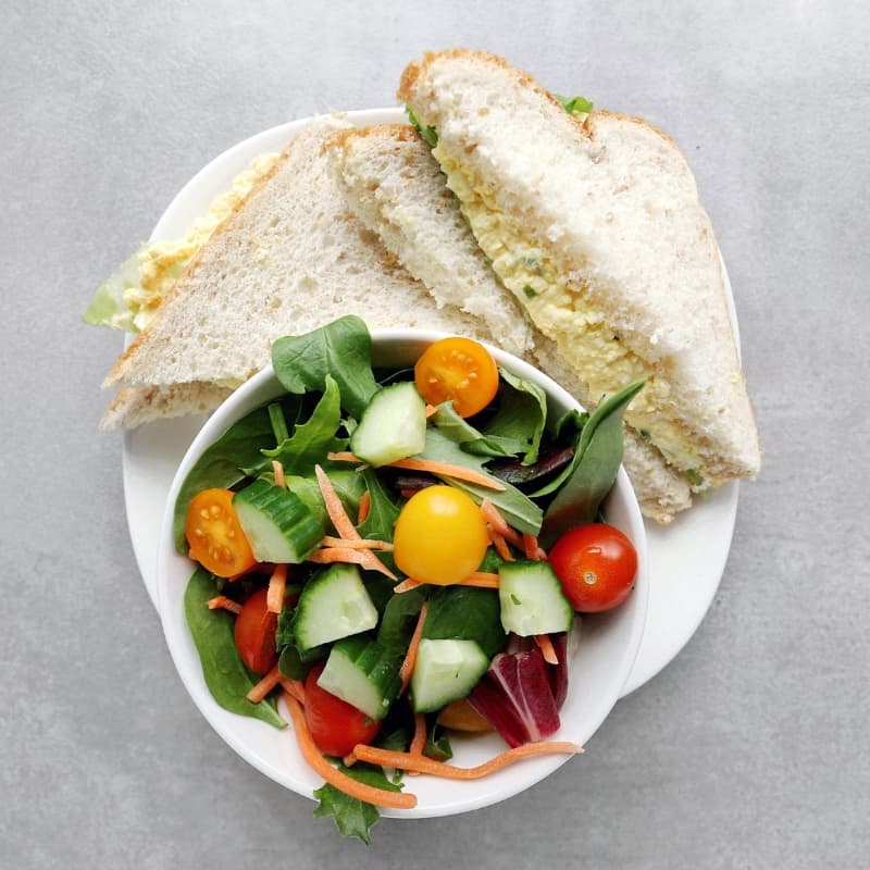 Low FODMAP Egg Salad Sandwich with garden salad - Feature Image