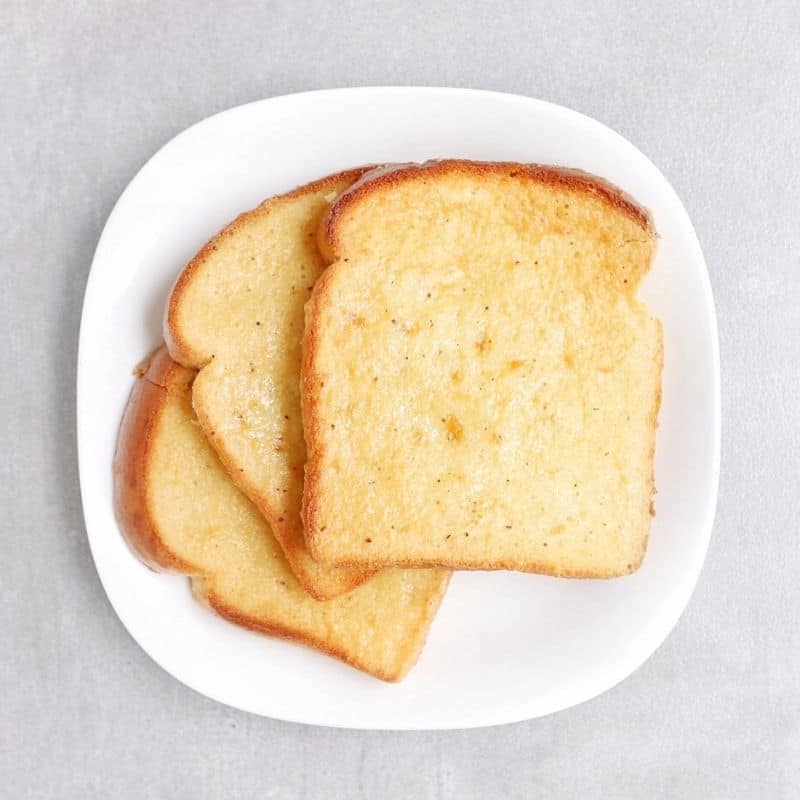 Low FODMAP eggnog french toast on white plate