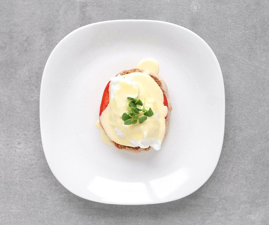 Low FODMAP Eggs Benedict on plate - 940 x 788