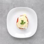 Low FODMAP Eggs Benedict on plate - Feature Image