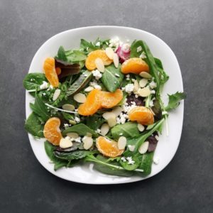 Low FODMAP mandarin orange salad with almonds on plate - 800 x 800