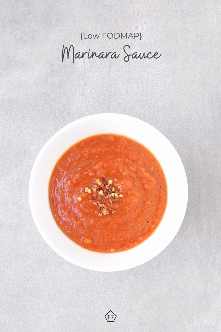 Marinara sauce in white bowl with text overlay: Low FODMAP Marinara sauce