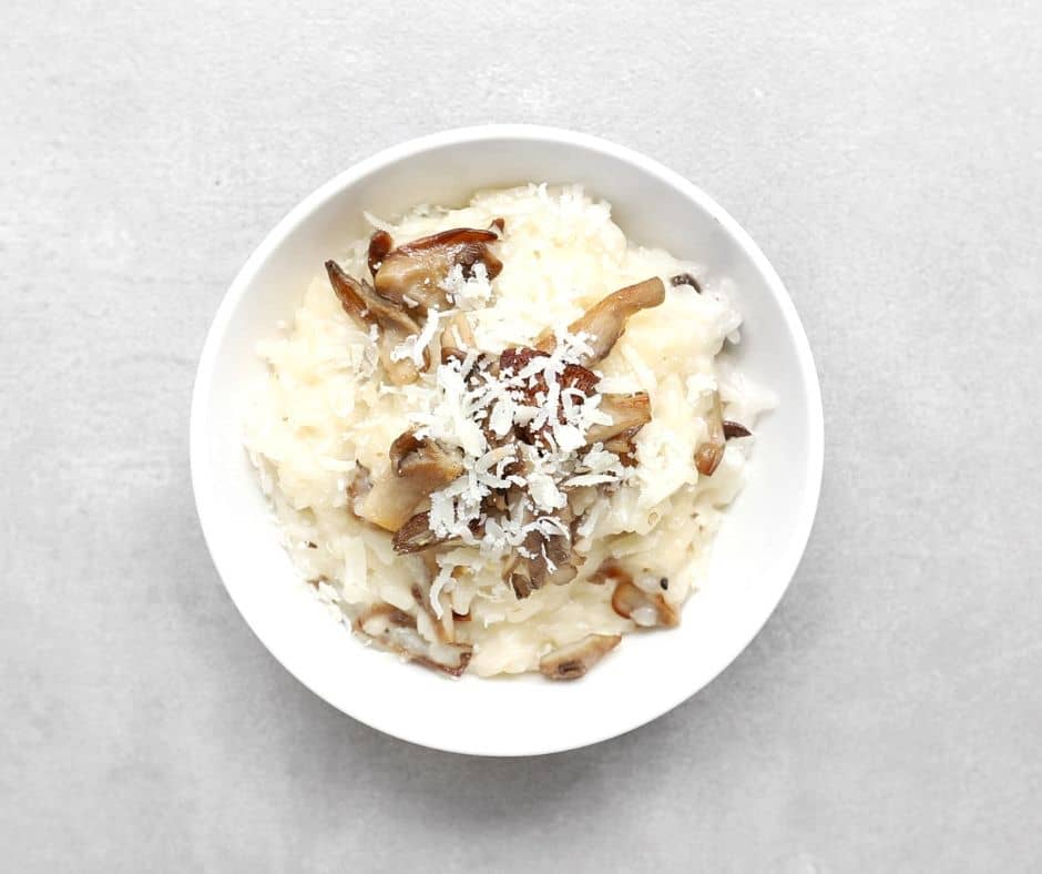 Low FODMAP mushroom risotto in white bowl