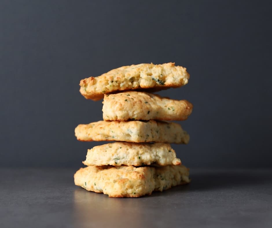 Low FODMAP Chive and Parmesan Scones Stacked on top of one another