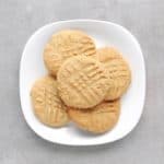 Low FODMAP peanut butter cookies piled on plate - Feature Image