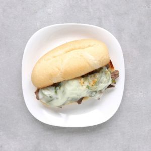 Low FODMAP Philly cheesesteak sandwich on plate - Feature Image