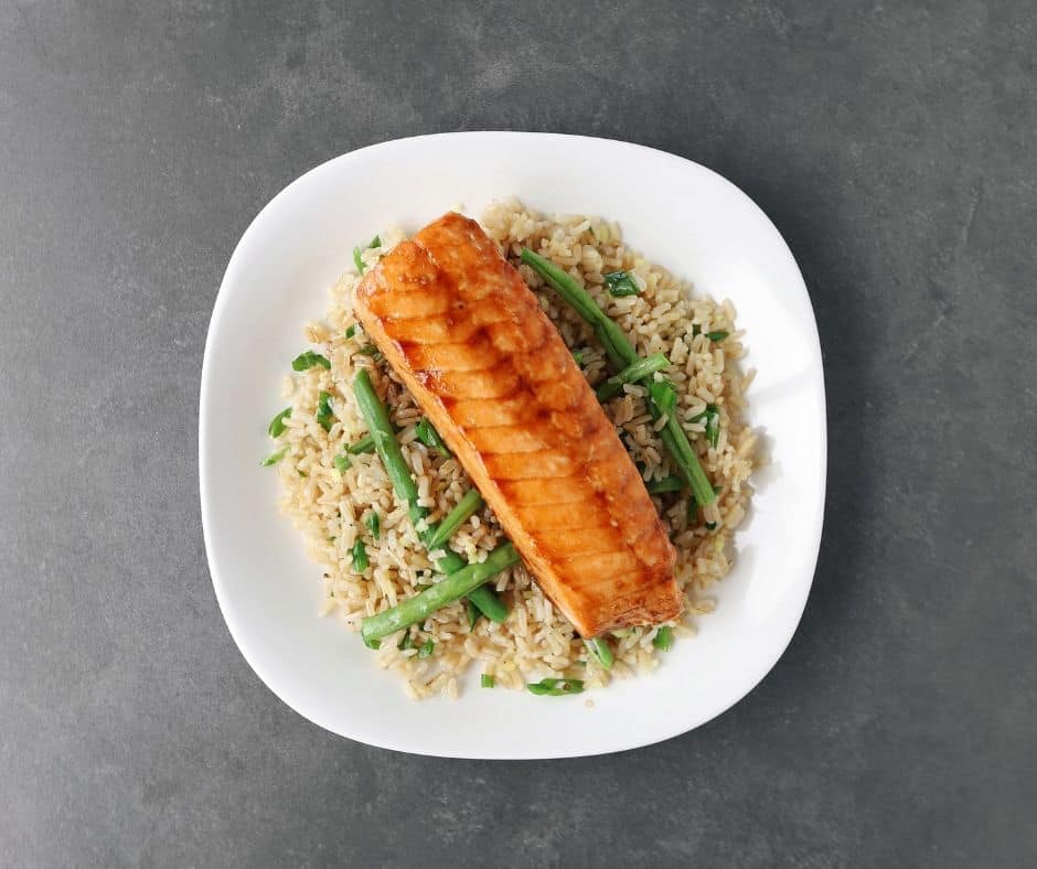 Low FODMAP soy-glazed salmon on a bed of green beans and rice - 940 x 788