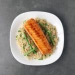 Low FODMAP soy-glazed salmon on a bed of green beans and rice - Feature Image