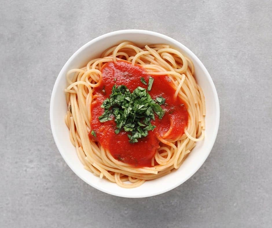 Tomato Basil Pasta Sauce on Spaghetti in bowl - 940 x 788