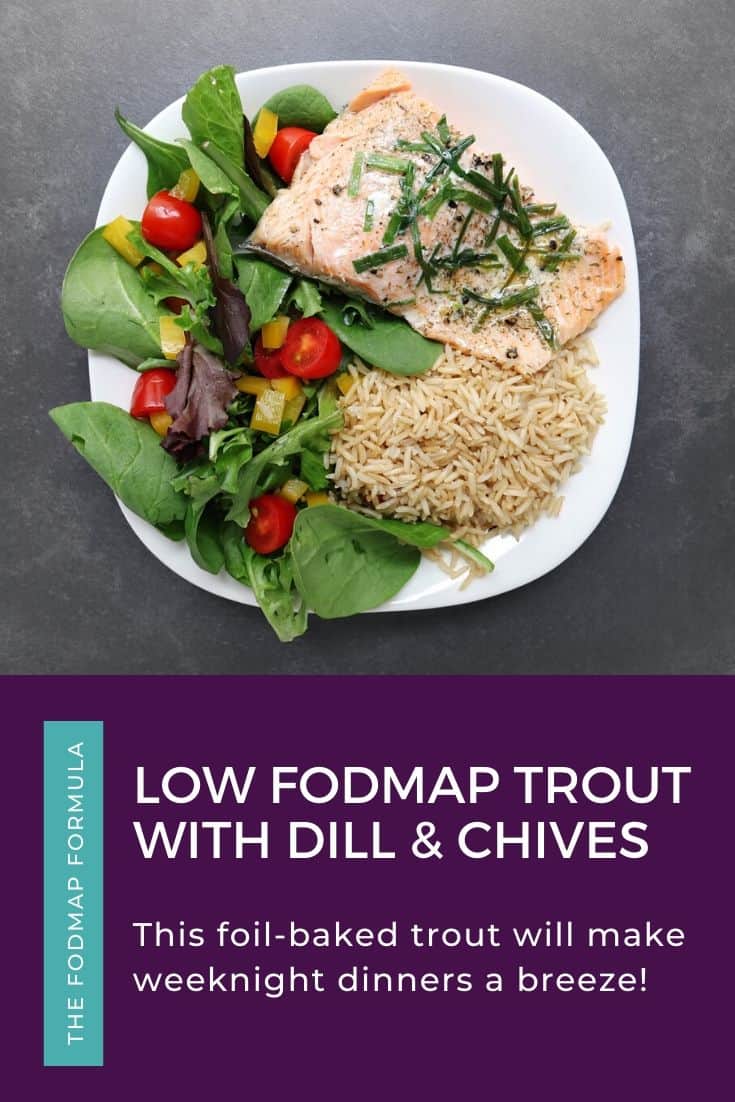 Low FODMAP trout with brown rice and garden salad on plate