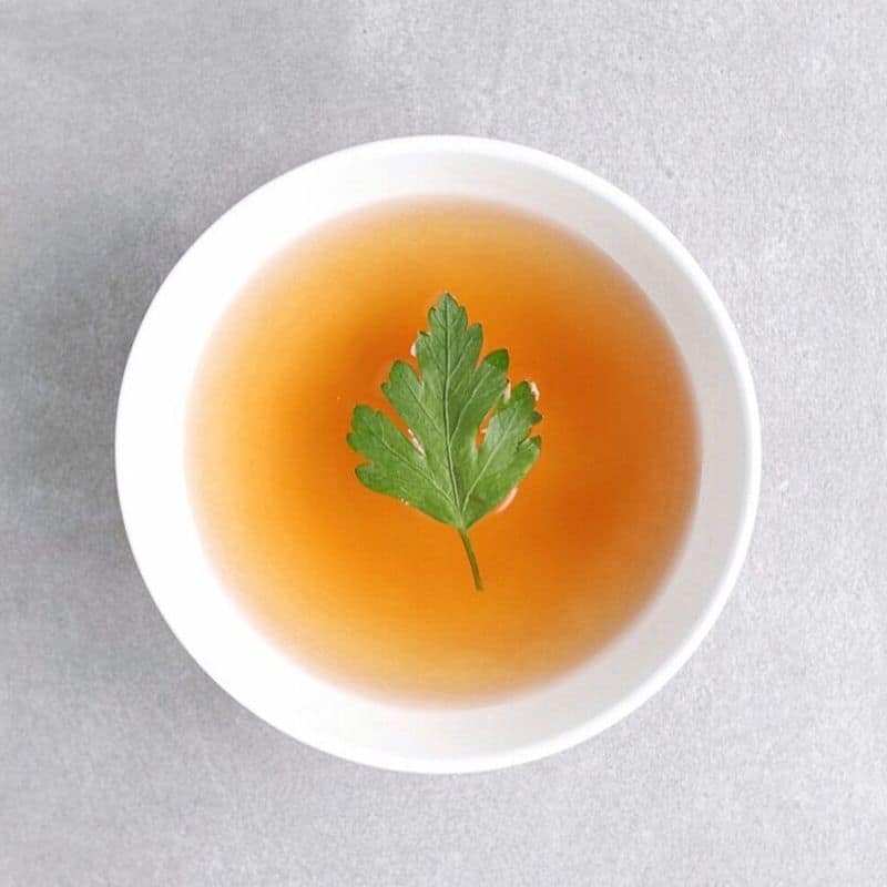 Low FODMAP vegetable broth with parsley leaf