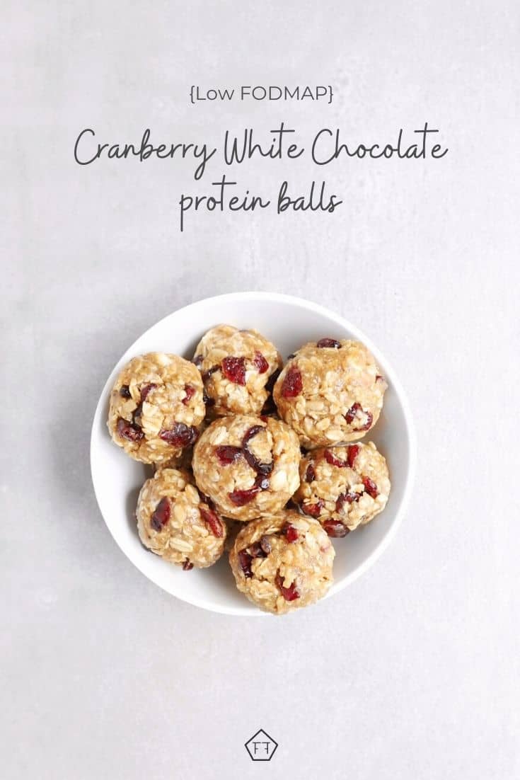 Low FODMAP cranberry white chocolate protein balls in white bowl