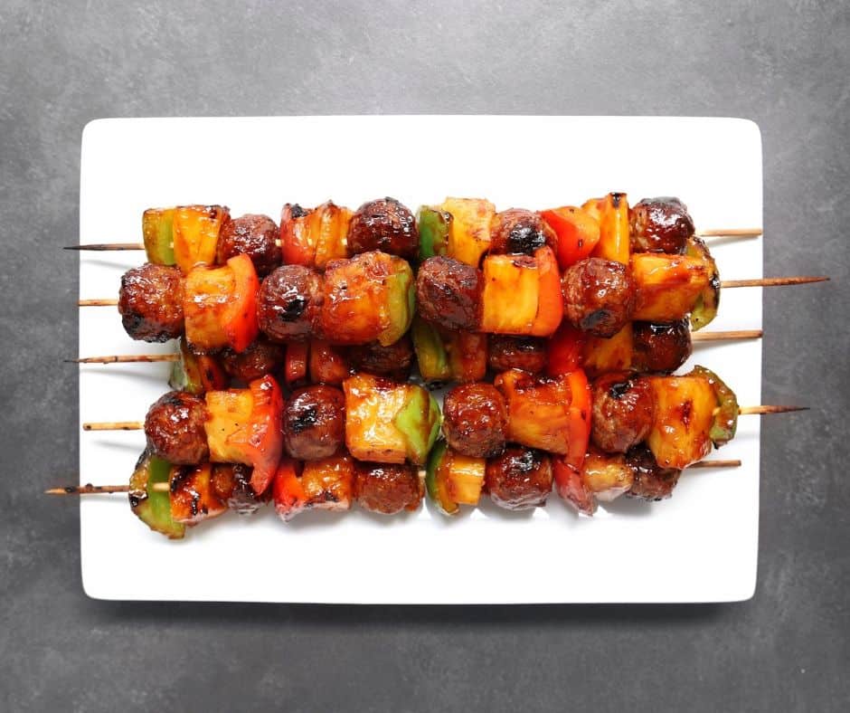 Low FODMAP meatball kebabs piled on plate