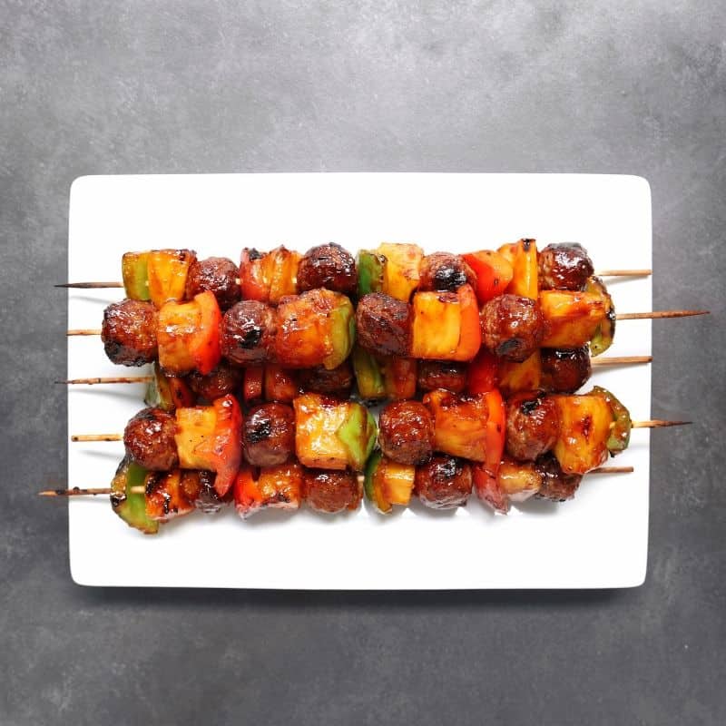 Low FODMAP meatball kebabs piled on plate