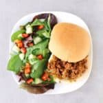 Low FODMAP sloppy Joe on white plate with side salad