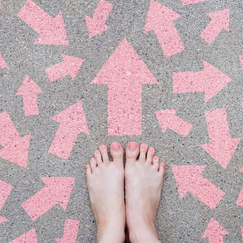 bare feet surrounded by arrows