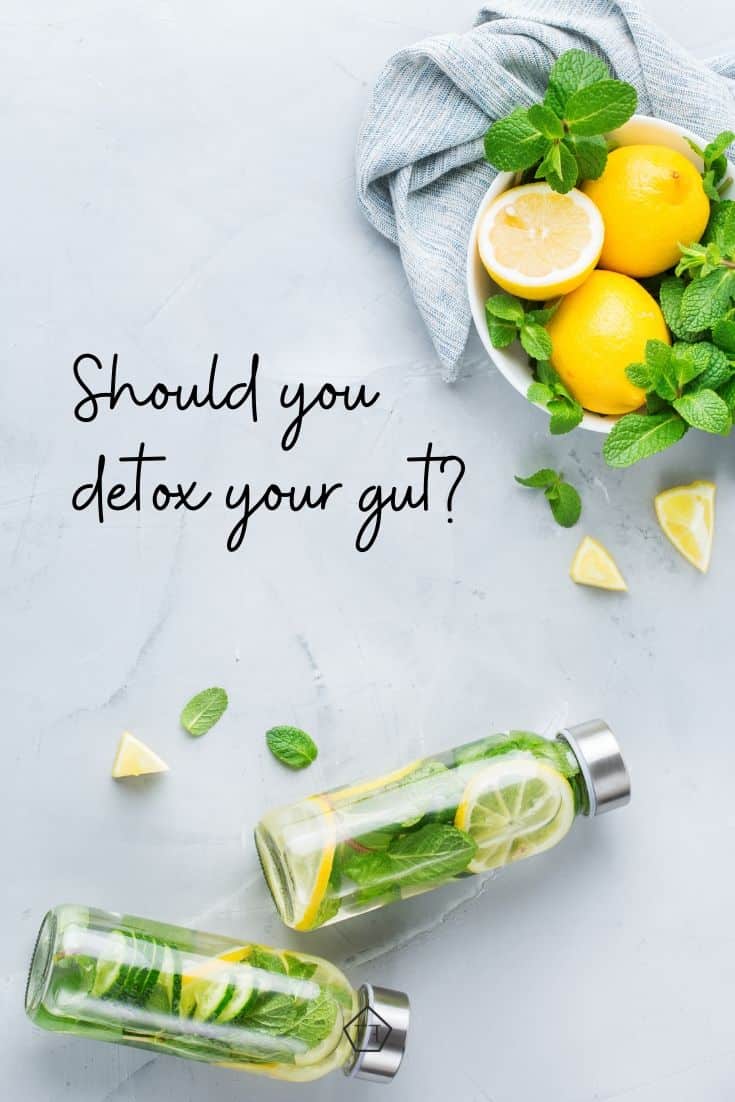 Lemons in a bowl and two glass gars filled with sliced lemons and limes with text overlay: should you cleanse your gut?